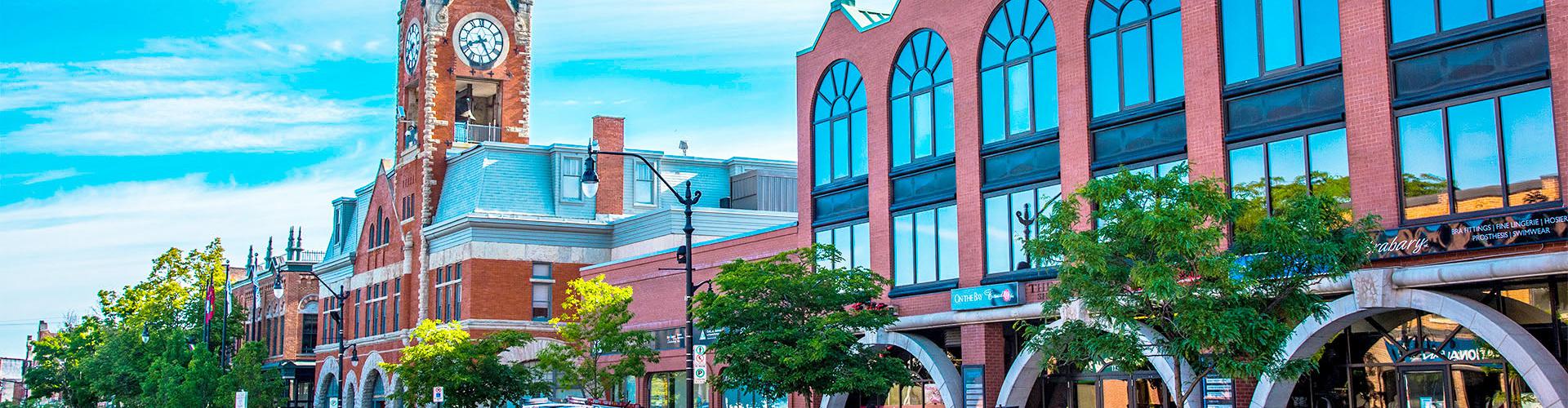 A downtown street with a clock tower
